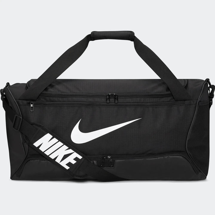 Black Nike Brasilia 95-liter duffel bag with white Nike swoosh logo and 'NIKE' text on the shoulder strap, front view.