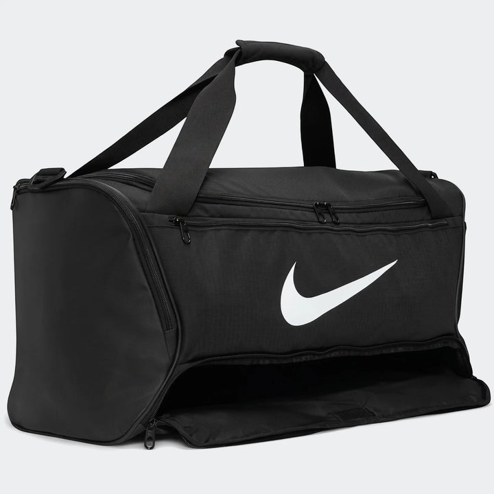 Black Nike Brasilia 95-liter duffel bag with white swoosh logo, top handles, and side pocket zipper, seen from a front angle.