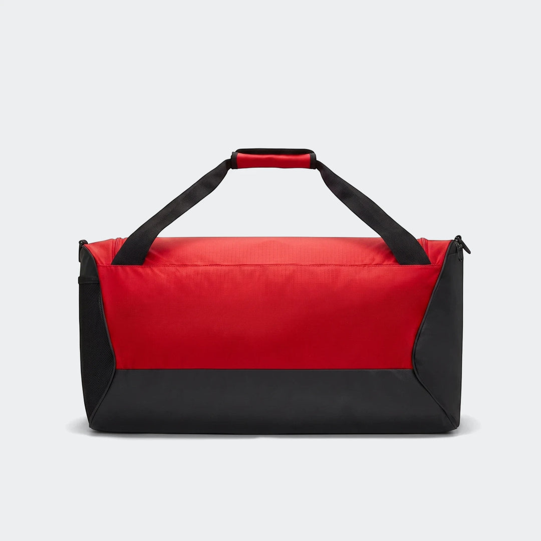 Red and black Nike Brasilia 60L medium duffel bag with black carrying straps and red handle grip, ideal for gym or travel.