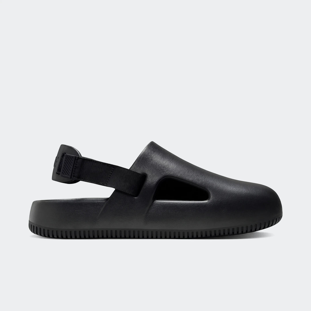 Black Nike Calm men's mules with a molded design and a slingback strap, shown in a side view.
