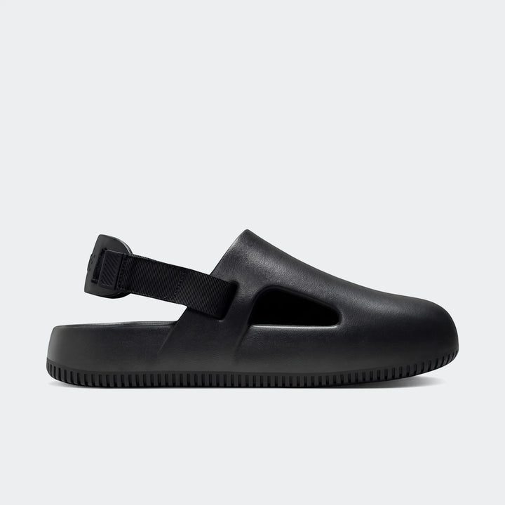 Black Nike Calm men's mules with a molded design and a slingback strap, shown in a side view.