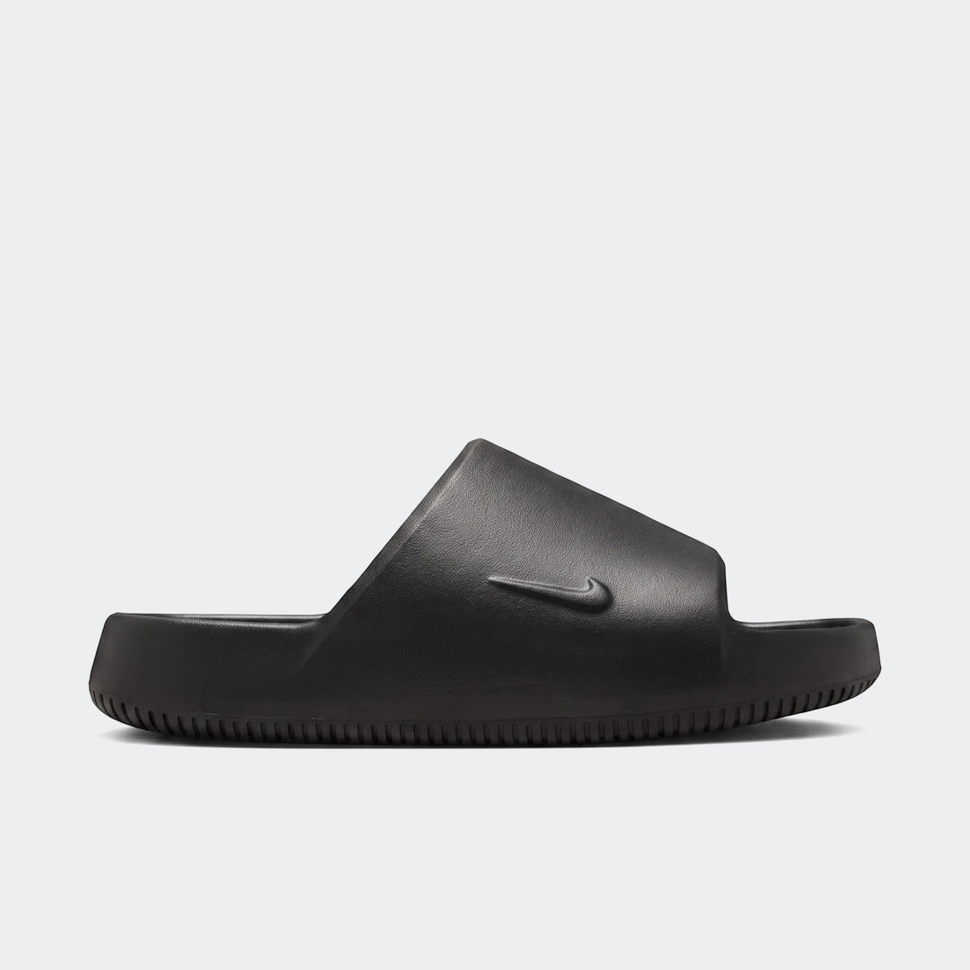A single black Nike Calm Slide 2.0, a comfortable men's or women's slip-on sandal, shown from a slightly angled side view.