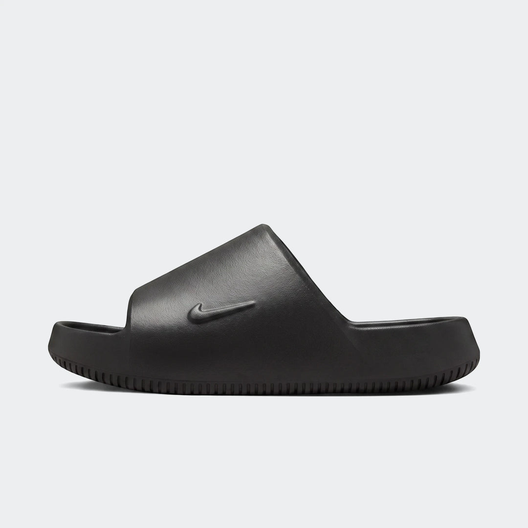Nike Calm Slide 2.0 black slide sandal, side view with molded foam strap and textured sole for casual wear.