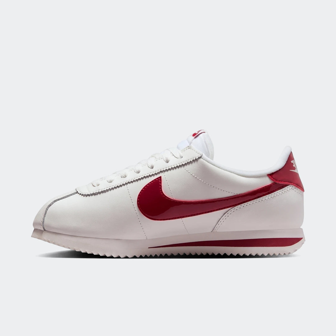 White and red Nike Cortez Leather Women's Shoes, captured in a side profile view, showcasing the classic design.