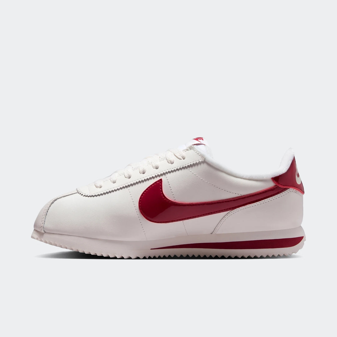 White and red Nike Cortez Leather Women's Shoes, athletic style, shown from a side profile view.