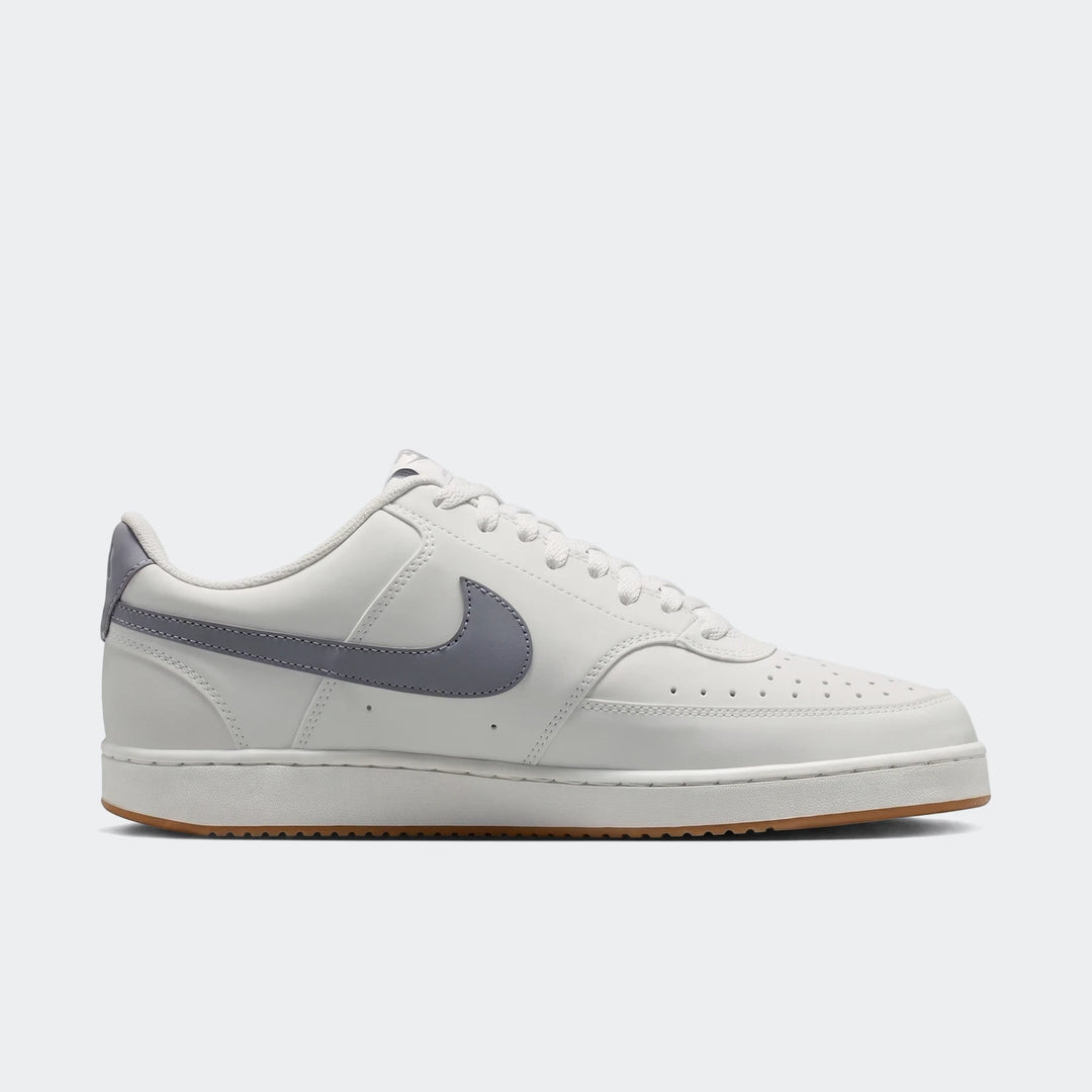 Nike Court Vision Low Men's Shoes in white with gray swoosh and brown gum sole, presented in a side profile view.