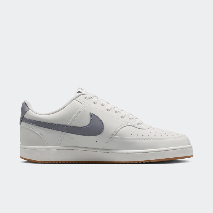 Nike Court Vision Low Men's Shoes in white with gray swoosh and brown gum sole, presented in a side profile view.