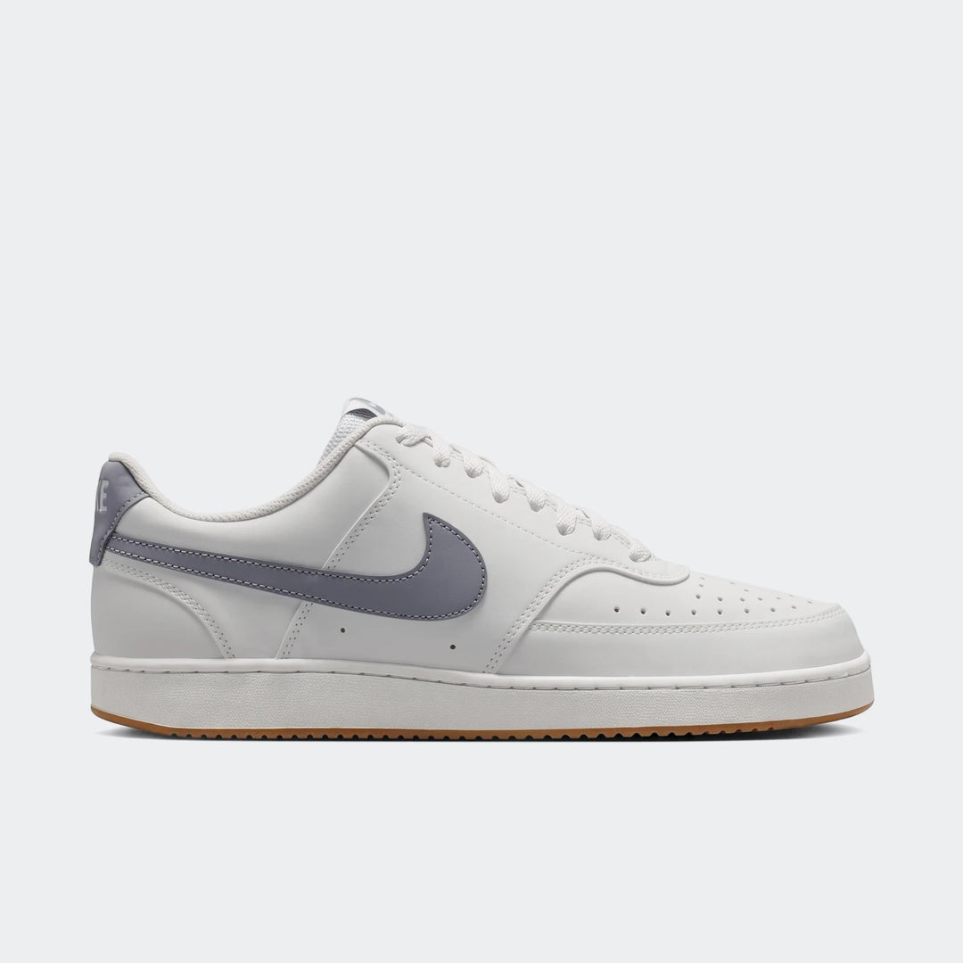 Nike Court Vision Low men's shoes in white with a gray swoosh and gum sole, shown from a side profile.