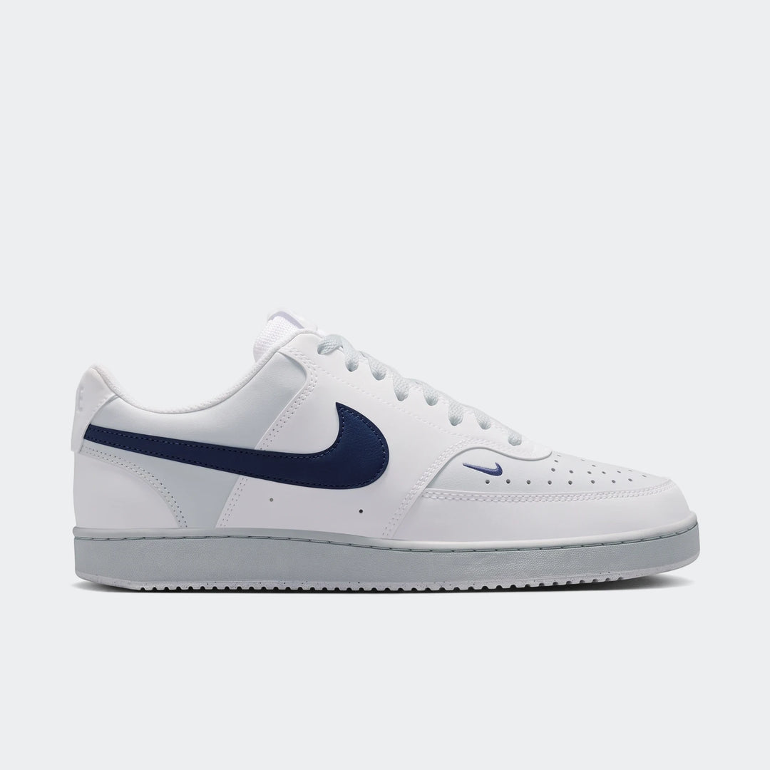 Nike Court Vision Low men's shoes in white with a navy blue swoosh logo, shown in a side view as a low-top sneaker.