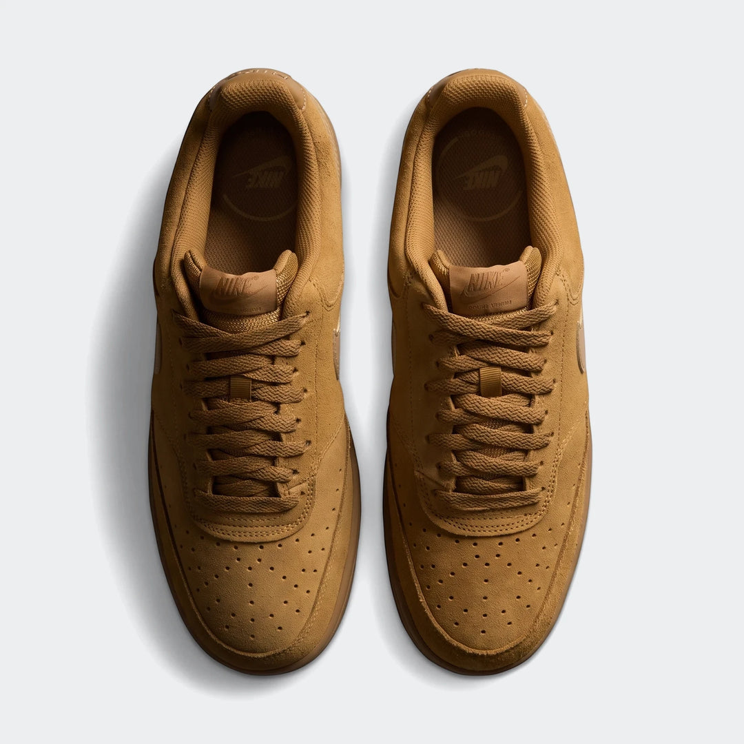 Overhead view of a pair of tan Nike Court Vision Low Suede Premium men's shoes, showcasing the suede texture and