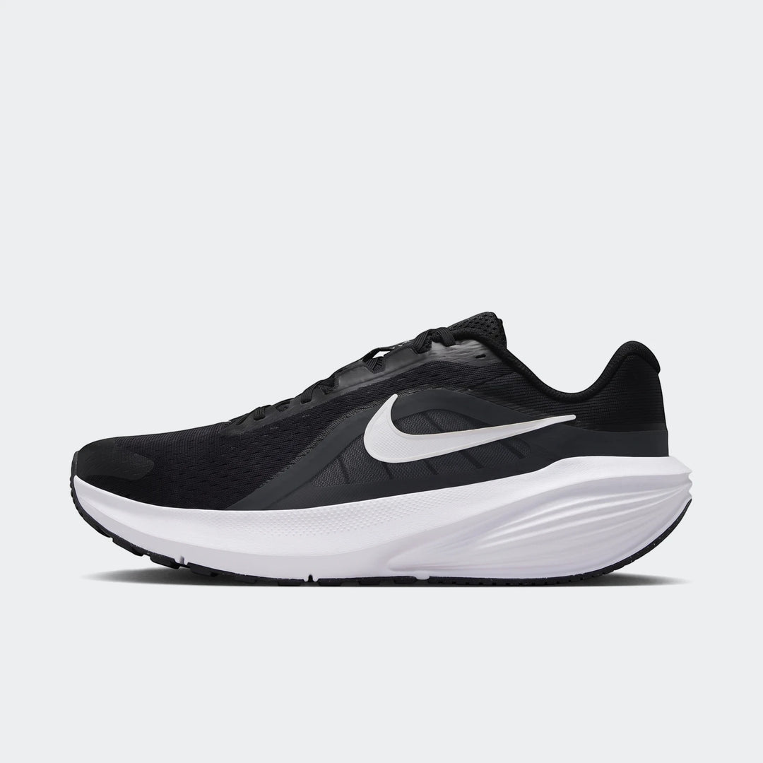 Black and white Nike Downshifter 14 men's road running shoe in a side profile view.