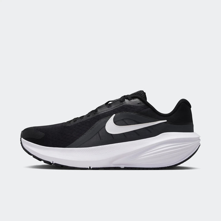 Black and white Nike Downshifter 14 men's road running shoe in a side profile view.