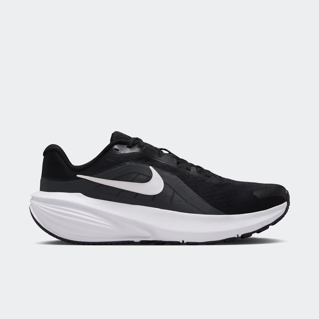 Nike Downshifter 14 men's road running shoe in black and white, presented in a side view.