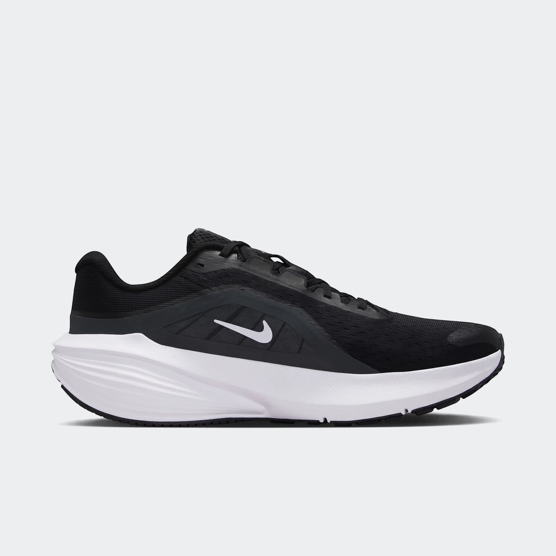 A black Nike Downshifter 14 men's road running shoe with a white sole, shown from a side view.