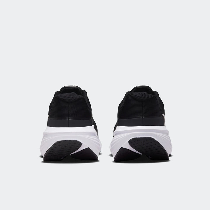 Rear view of Nike Downshifter 14 Men's Road Running Shoes in black and white, showcasing the heel and sole design.