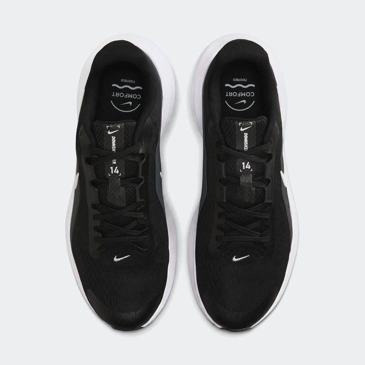 Pair of Nike Downshifter 14 men's road running shoes in black and white, viewed from directly above.