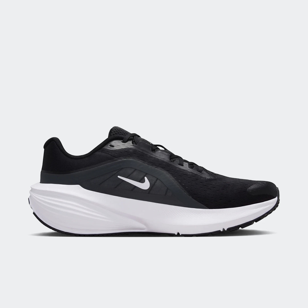 Nike Downshifter 14 men's road running shoe in black and white, presented in a side profile view.