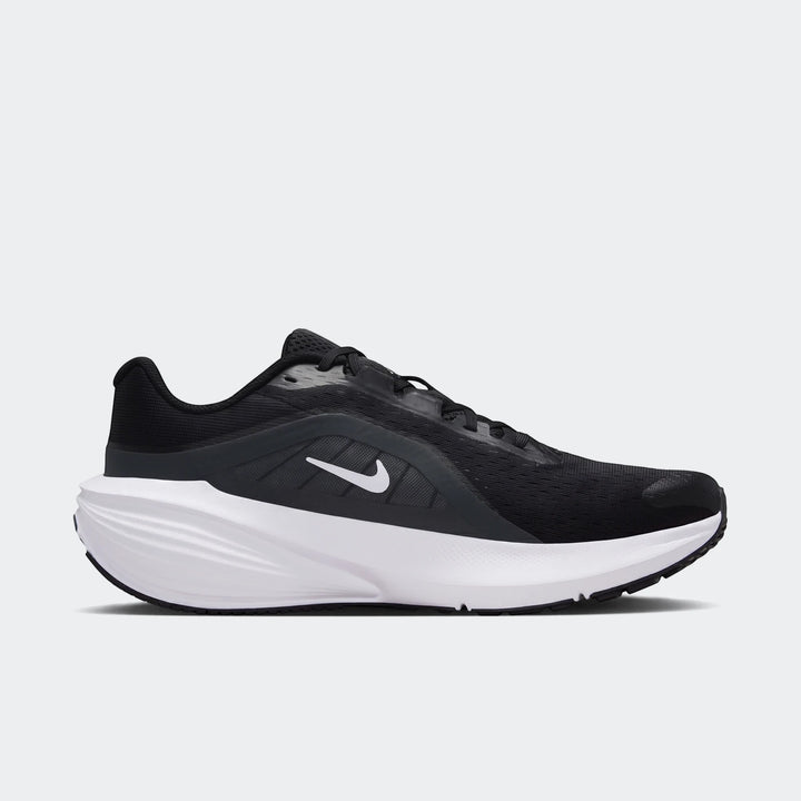 Nike Downshifter 14 men's road running shoe in black and white, presented in a side profile view.