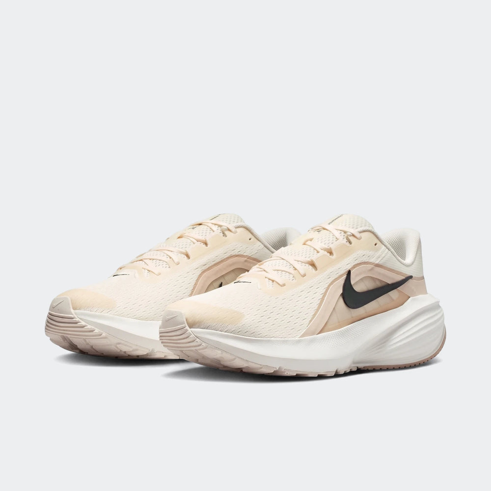 Nike Downshifter 14 White Men's Road Running Shoe in a light cream color with a black swoosh, presented in a side view.