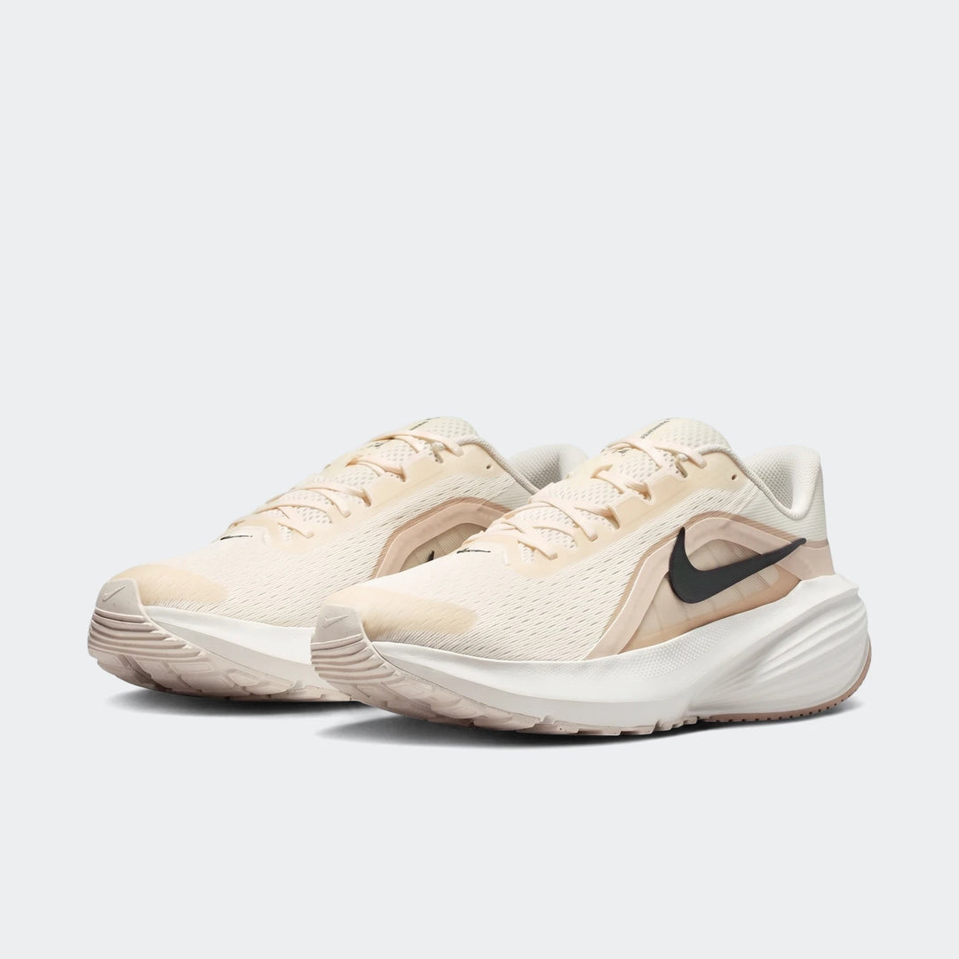 Nike Downshifter 14 White Men's Road Running Shoe in a light cream color with a black swoosh, presented in a side view.