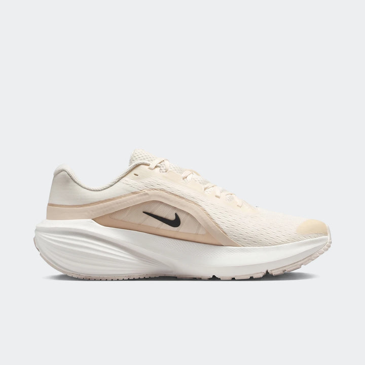 Nike Downshifter 14 men's road running shoe in beige and white, captured in a side view.