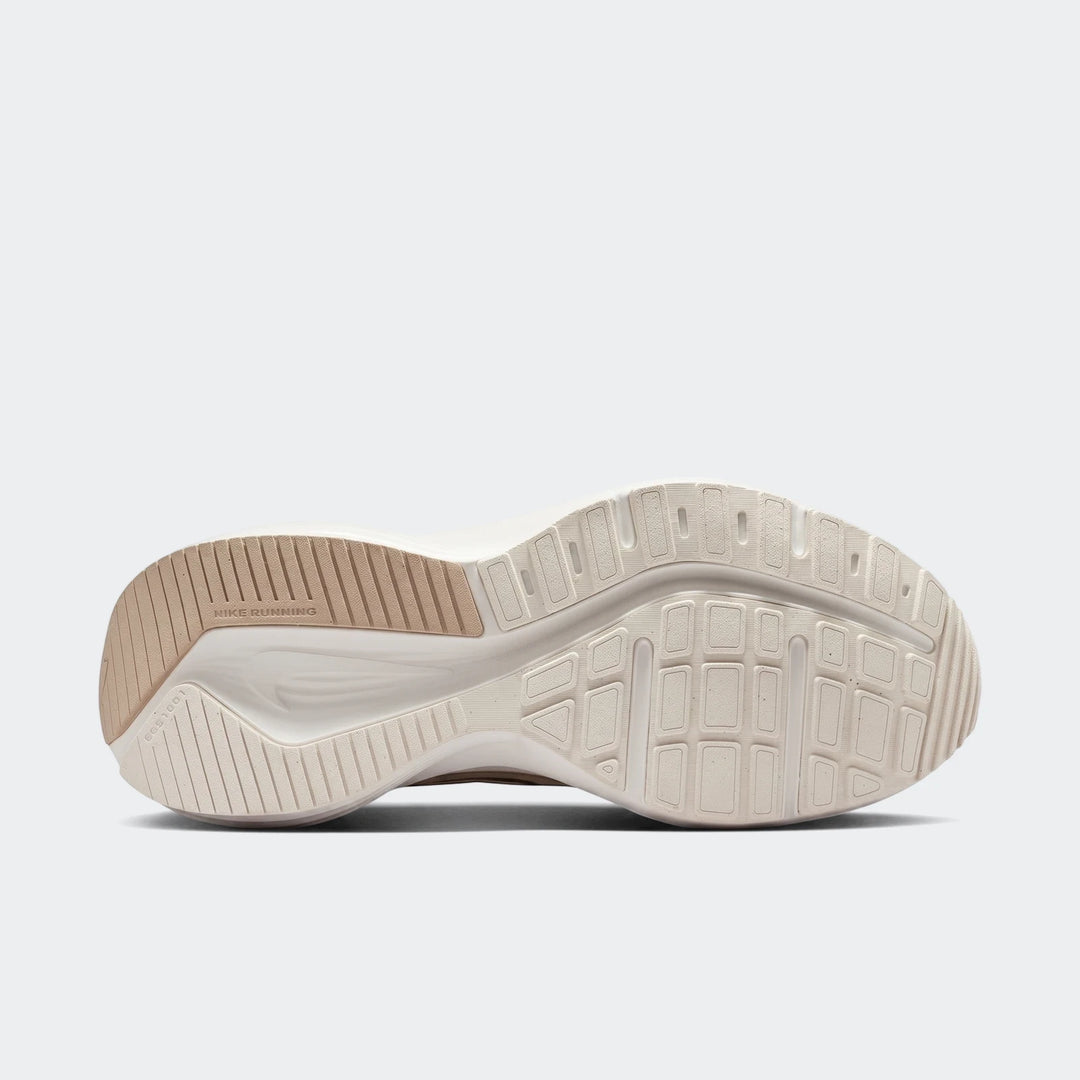 Sole view of a Nike Downshifter 14 White Men's Road Running Shoe, featuring its off-white and beige rubber outsole design.