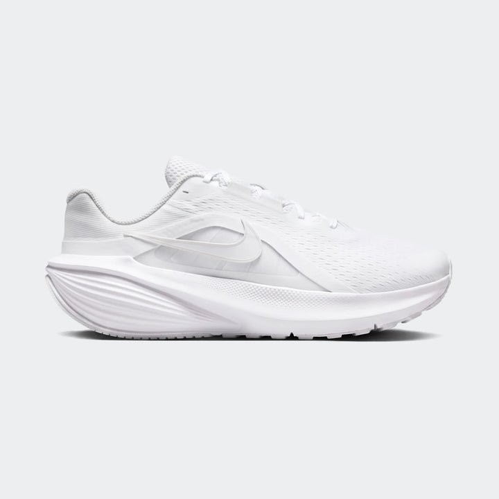 Side view of a pristine white Nike Downshifter 14 running shoe, featuring a breathable mesh upper and a supportive sole.