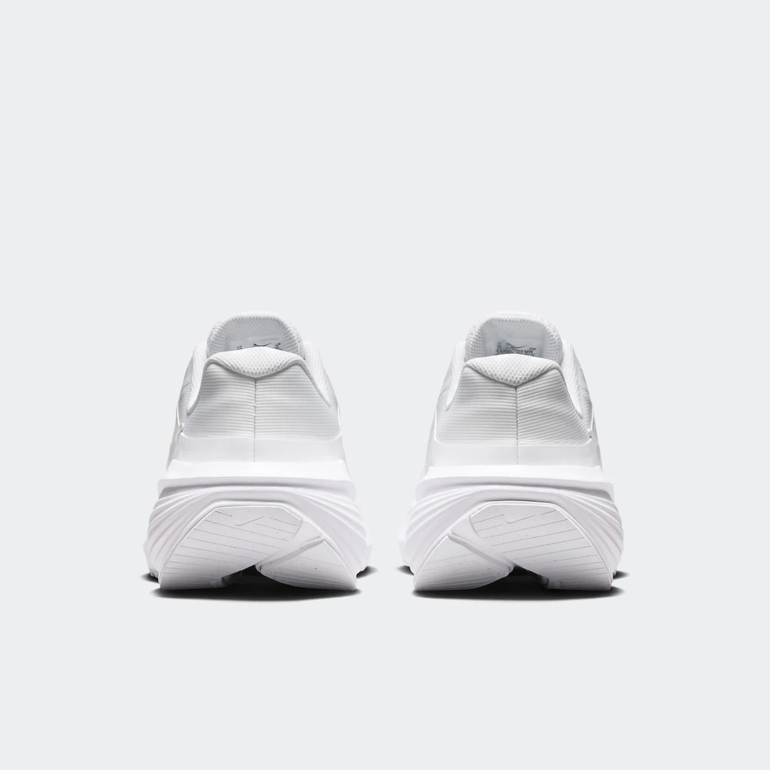 Back view of two Nike Downshifter 14 white sneakers, showcasing the clean design and sole details.