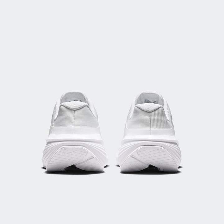 Back view of two Nike Downshifter 14 white sneakers, showcasing the clean design and sole details.