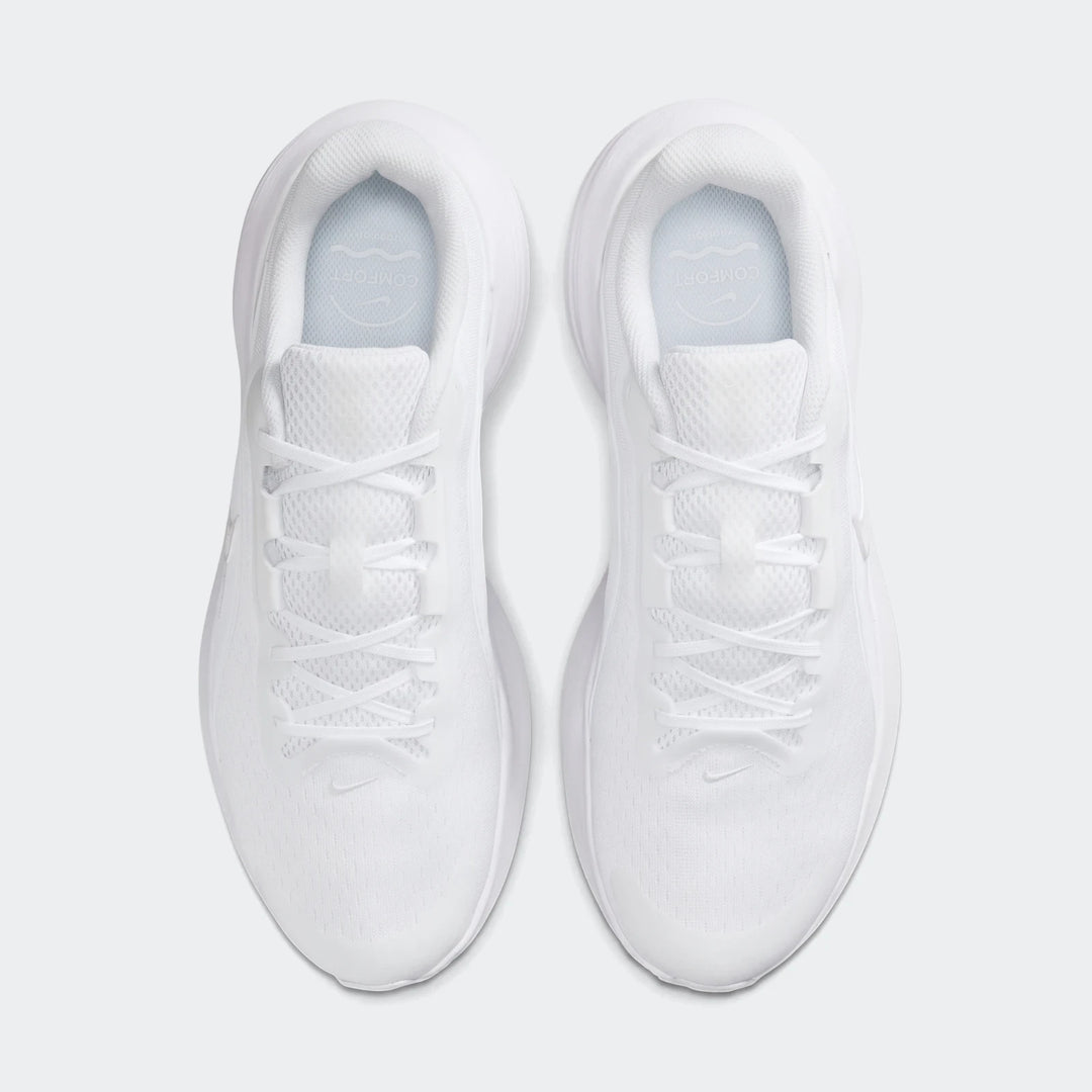 Pair of white Nike Downshifter 14 athletic sneakers in a top-down view, showcasing laces and mesh upper.