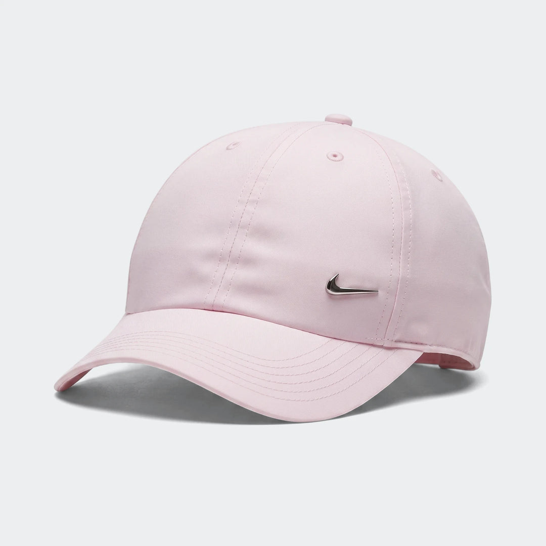 Light pink Nike Dri-Fit Club baseball cap with a silver metallic swoosh logo on the front, captured in a product shot.