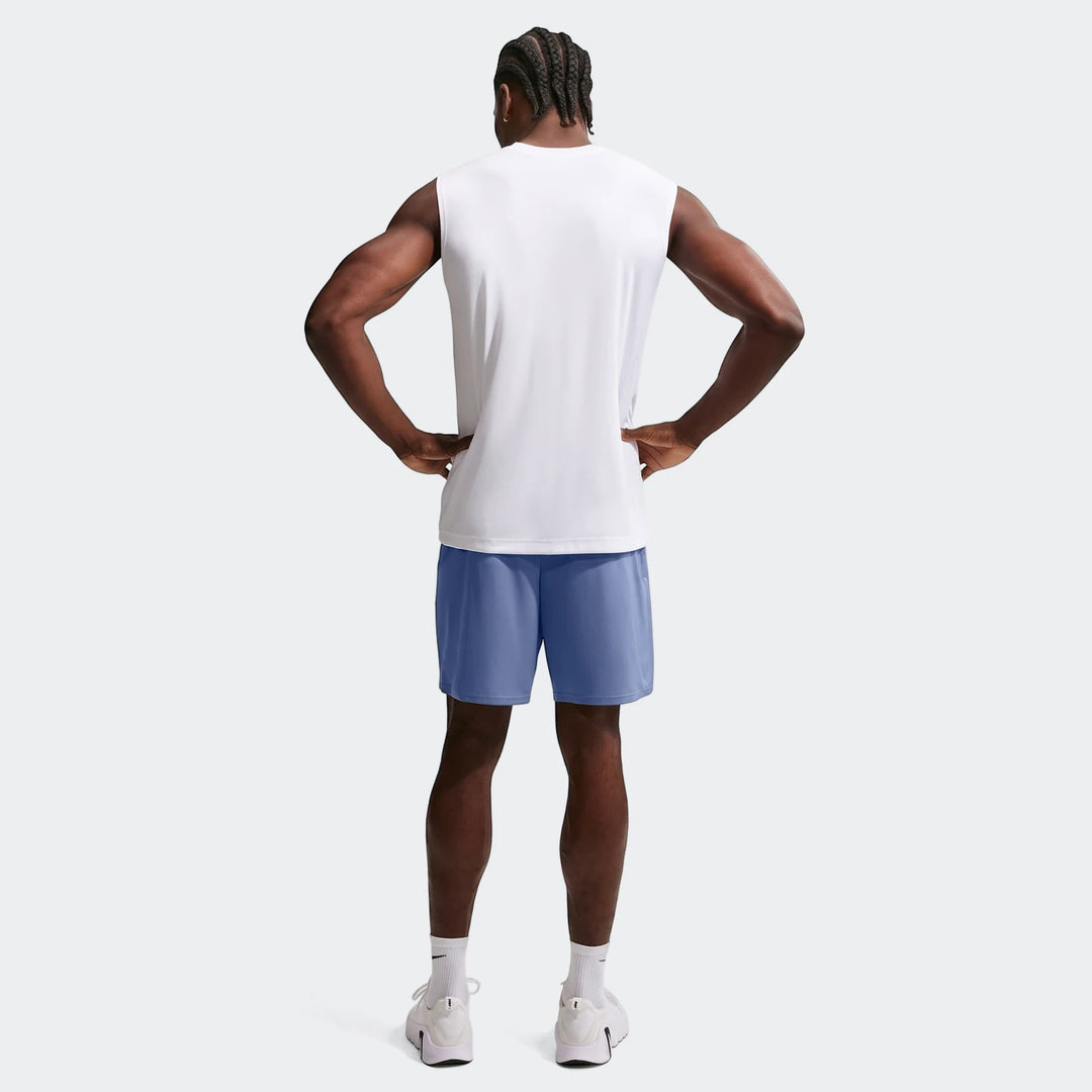 Men's Nike Flex Dri-Fit 7" training shorts in blue, paired with a white sleeveless top, shown from the back.