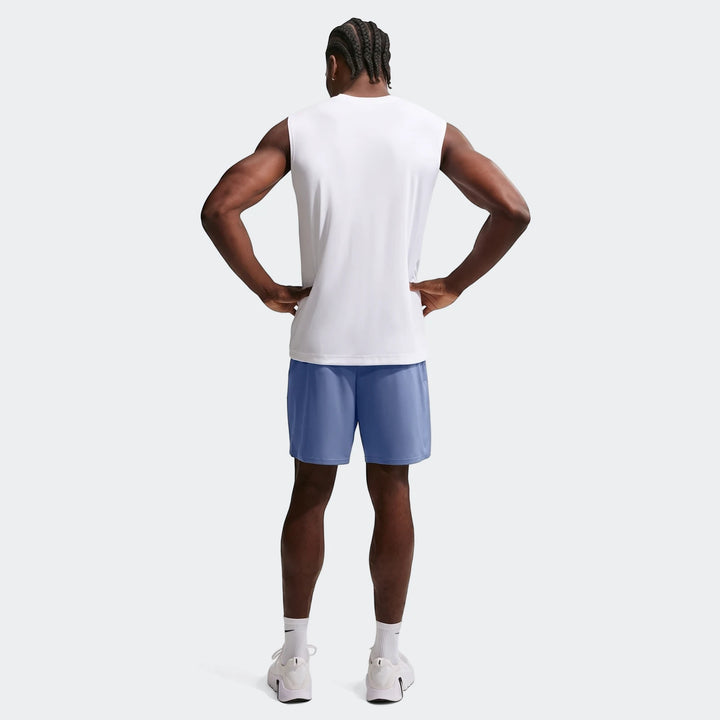 Men's Nike Flex Dri-Fit 7" training shorts in blue, paired with a white sleeveless top, shown from the back.