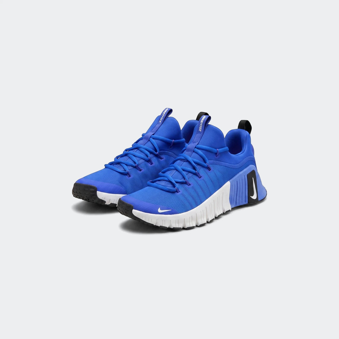 Pair of blue Nike Free Metcon 6 training sneakers featuring a breathable mesh upper and white textured sole.