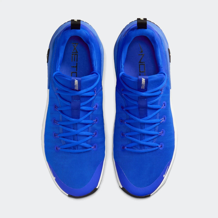 Pair of Nike Free Metcon 6 men's training shoes in vibrant royal blue with white soles, viewed from an overhead perspective.
