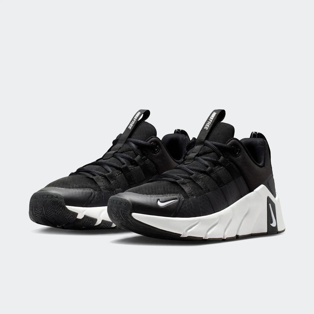 A pair of black and white Nike Free Metcon 7 women's training shoes, shown at a slight angle on a white background.