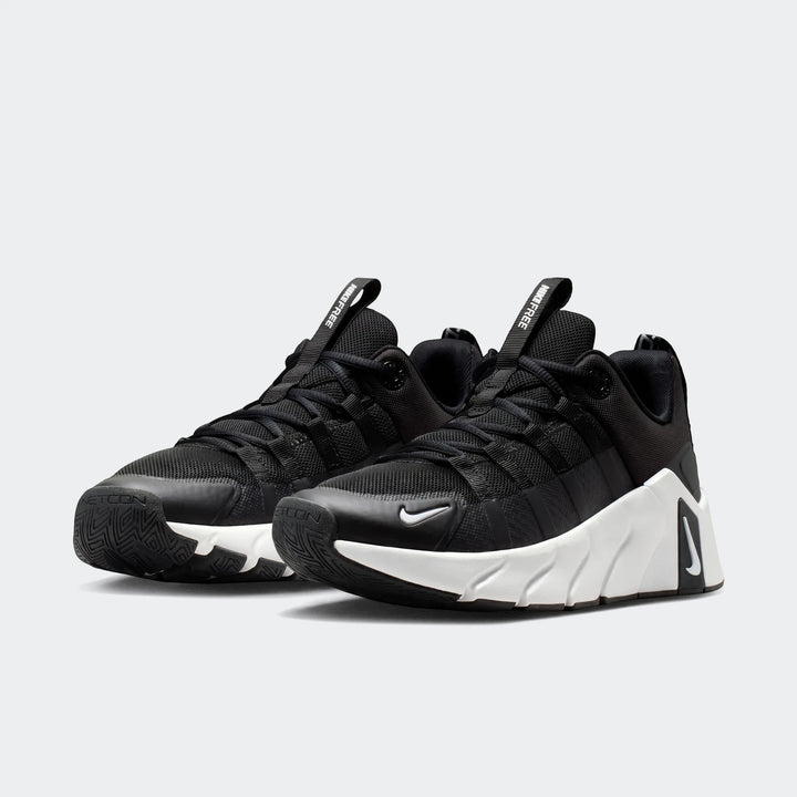 A pair of black and white Nike Free Metcon 7 women's training shoes, shown at a slight angle on a white background.
