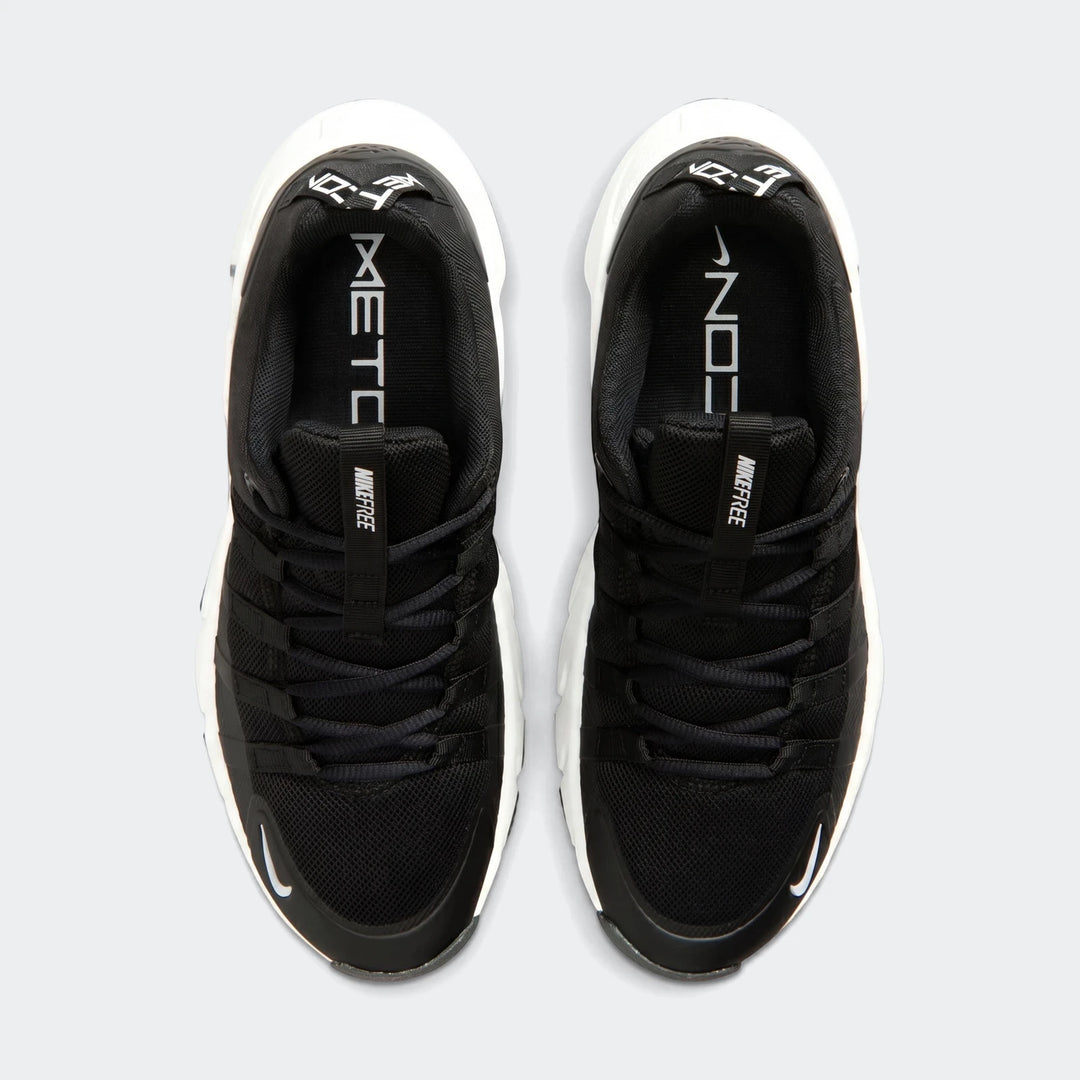 Top-down view of two black Nike Free Metcon 7 women's training shoes with white soles and branding.