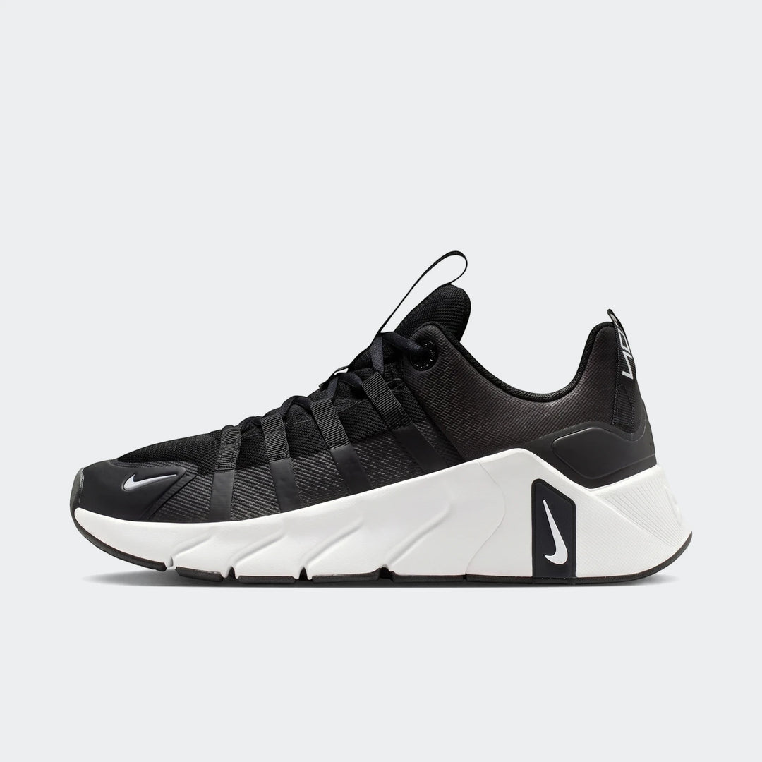Nike Free Metcon 7 women's training shoes in black and white, featuring a sculpted white sole and a prominent side swoosh