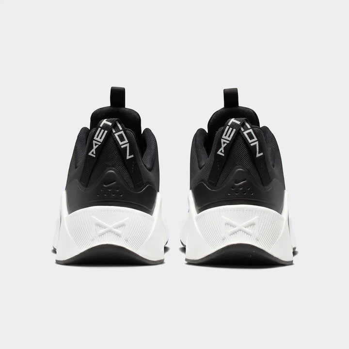Rear view of Nike Free Metcon 7 women's training shoes in black with white soles and 'METCON' heel straps.
