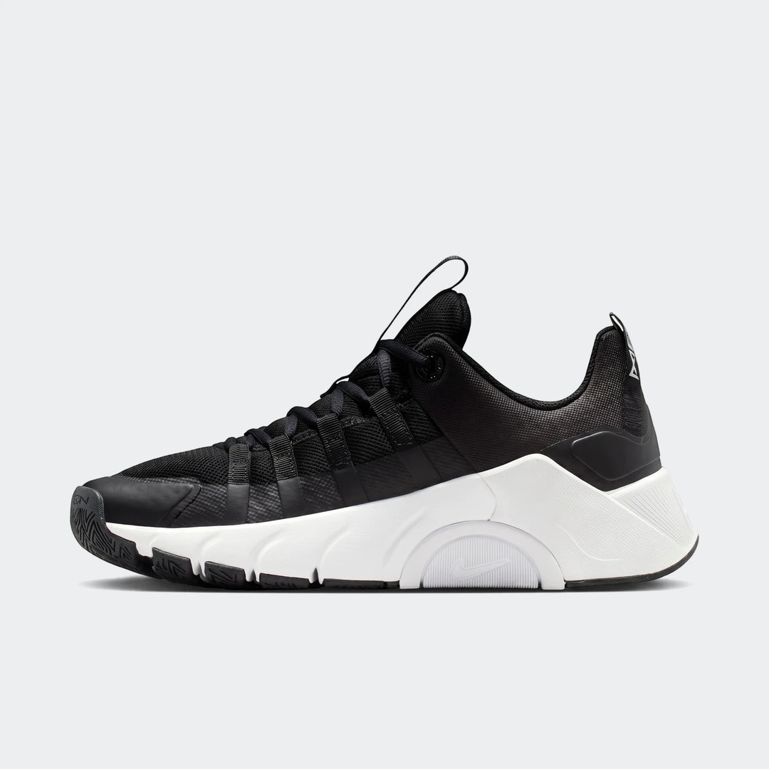 Nike Free Metcon 7 women's training shoes in black and white, featuring a mesh upper and sculpted midsole, shown in a side