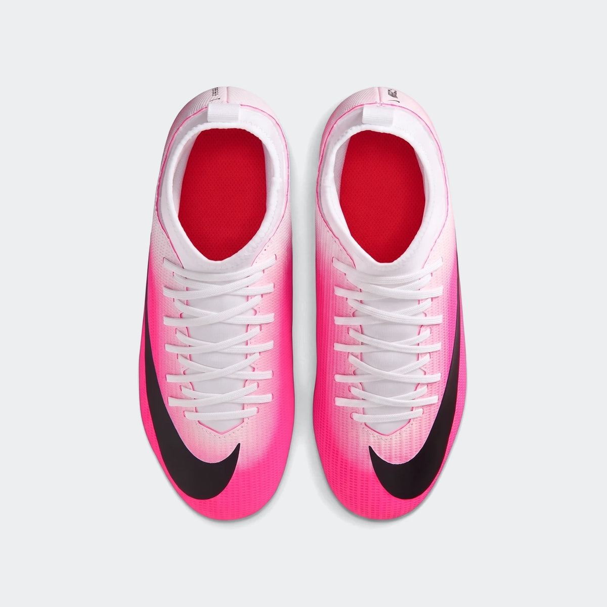 Pink and white Nike Jr. Mercurial Superfly 11 Club Big Kids' Multi-Ground High-Top Soccer Cleats with black swoosh, top-down