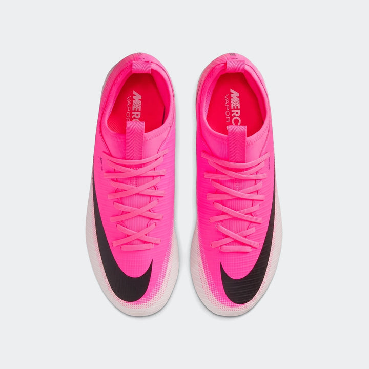 Top-down view of bright pink Nike Jr. Mercurial Vapor 17 Academy Big Kids' Multi-Ground Soccer Cleats with black swooshes.