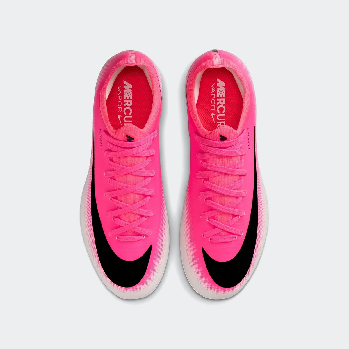 Hot pink Nike Jr. Mercurial Vapor 17 Pro Big Kids' firm-ground soccer cleats with black swoosh, shown from a top-down view.