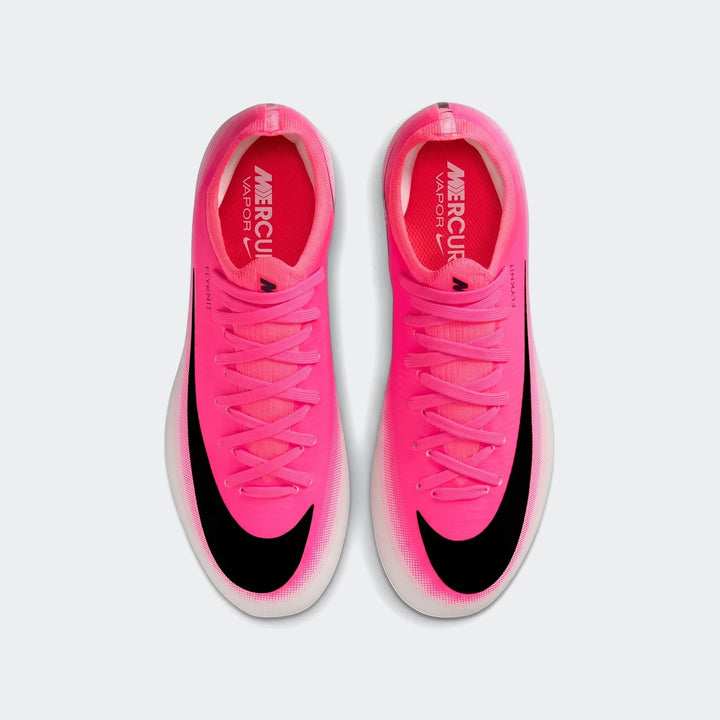 Hot pink Nike Jr. Mercurial Vapor 17 Pro Big Kids' firm-ground soccer cleats with black swoosh, shown from a top-down view.