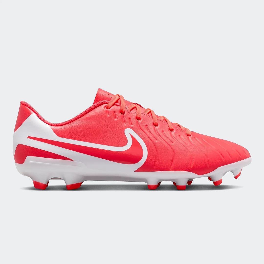 Red and white Nike Legend 10 Club FG/MG soccer cleat, side view, showcasing the iconic swoosh and studded sole.