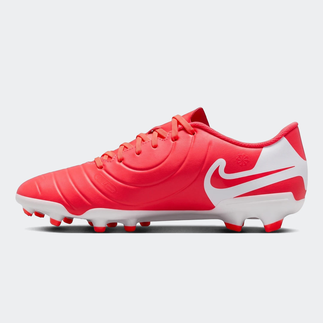 Nike Legend 10 Club Fg/Mg red and white soccer cleats, shown from the side with textured upper and conical studs.