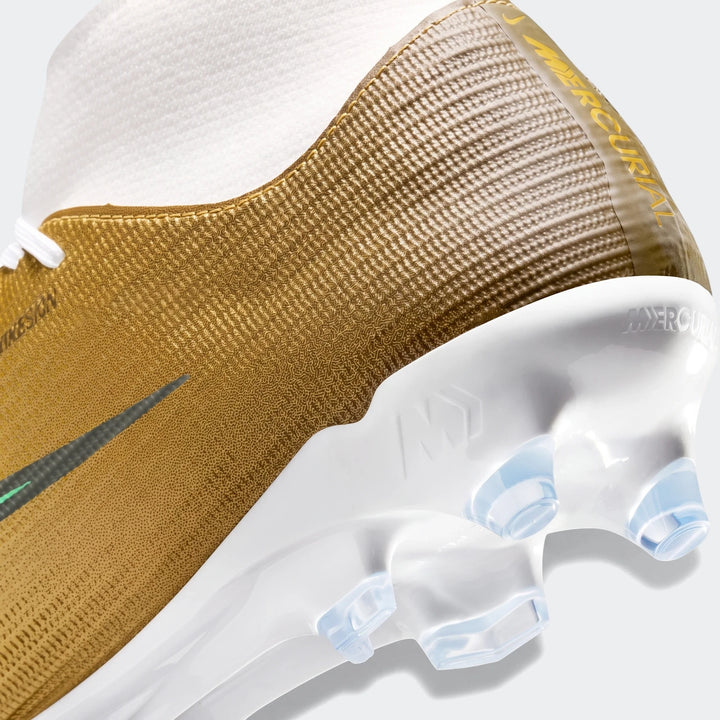 Close-up of a gold and white Nike Mercurial Superfly 11 Academy Kylian Mbappé high-top soccer cleat, showing the heel and