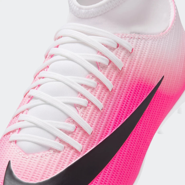 Close-up of a pink and white Nike Jr. Mercurial Superfly 11 Club Big Kids' Multi-Ground High-Top Soccer Cleat with white
