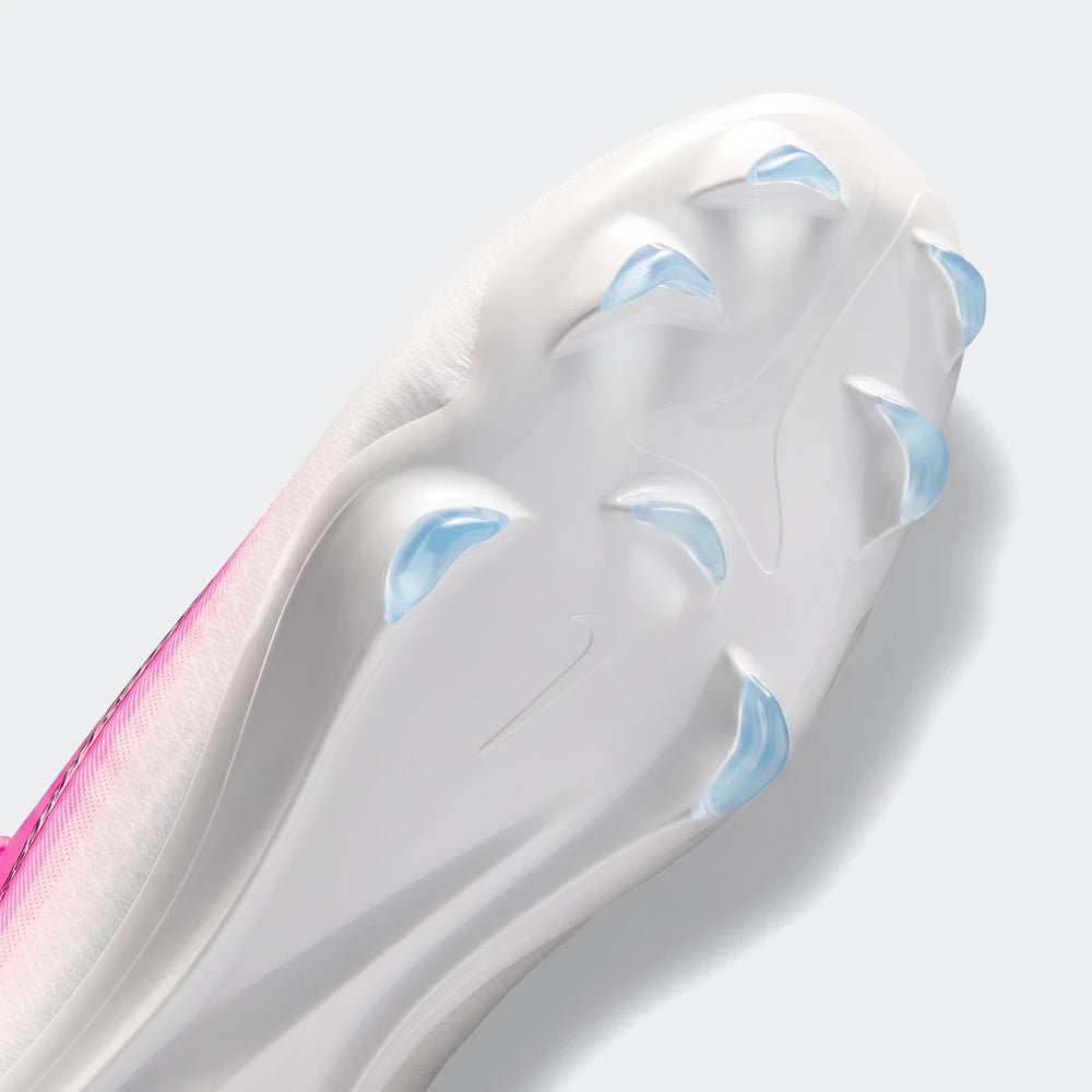 Nike Mercurial Vapor 17 Pro firm-ground low-top soccer cleat, in white and pink, showcasing its sole with translucent blue
